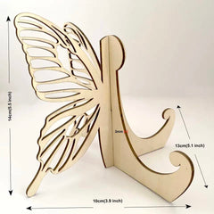 Wooden butterfly decorative item with measurements on a white background