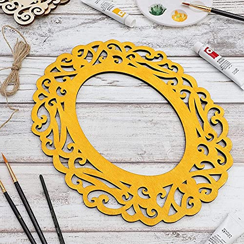 Yellow decorative frame on a wooden surface with painting supplies.