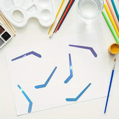 Art supplies including paintbrushes, a palette, and a glass of water on a white surface with abstract blue and purple shapes.