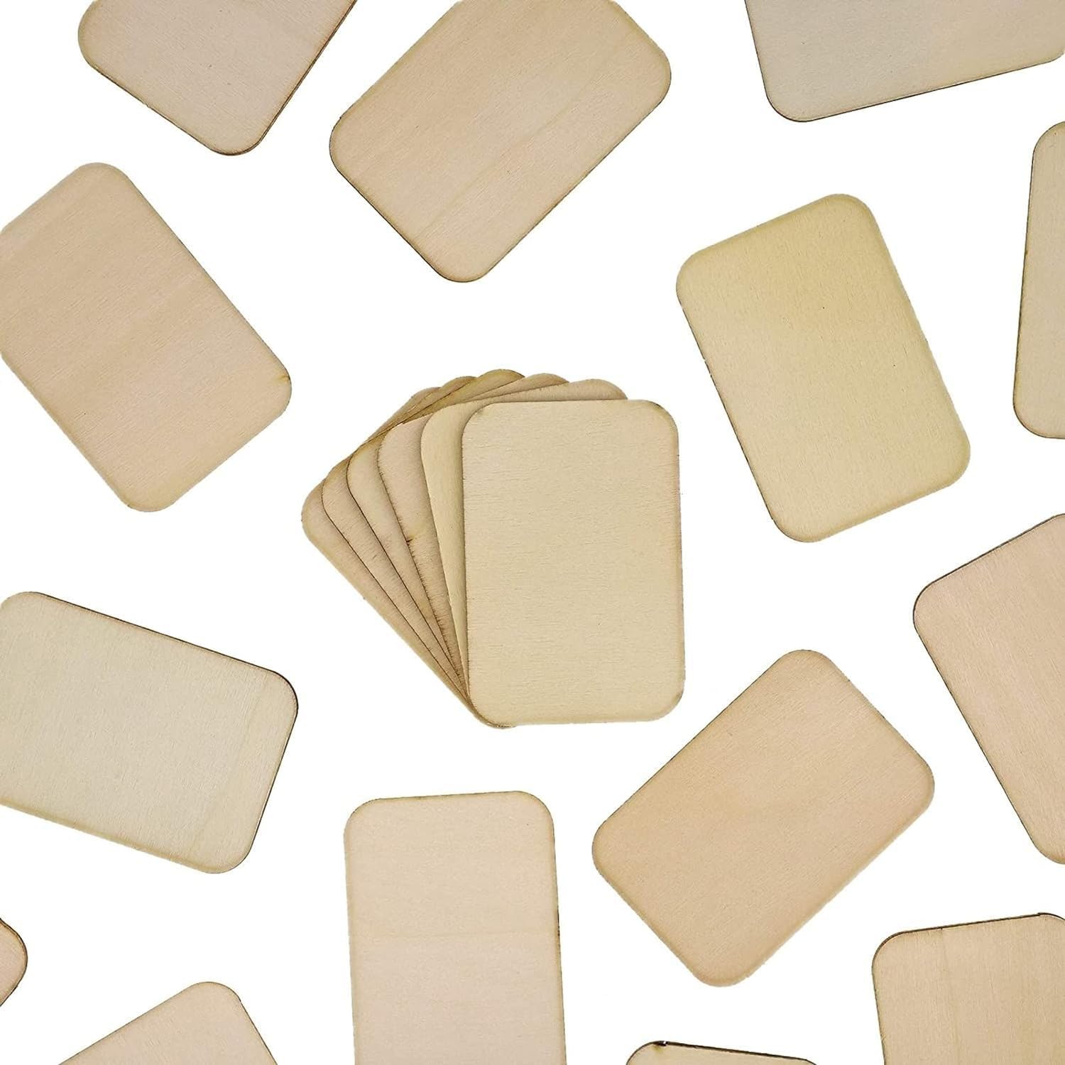 Beige square coasters scattered on a white background