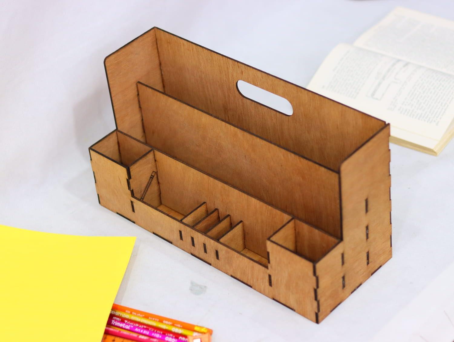Cardboard organizer with compartments on a white surface