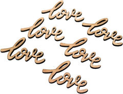 Wooden cutouts with 'love' text on a white background