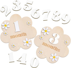 Wooden baby milestone cards with flowers and numbers on a white background