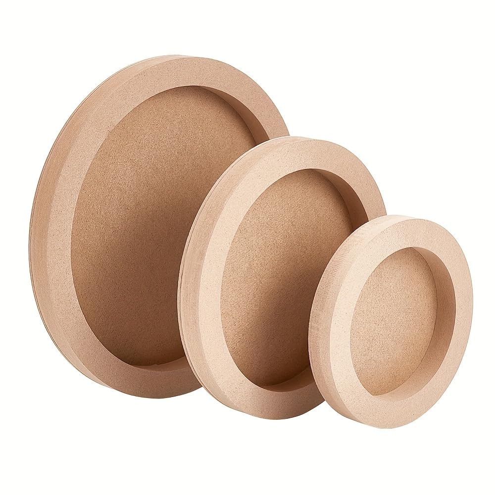 Three wooden circular objects of different sizes on a white background