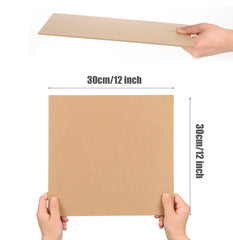 Cardboard sheet held by hands with dimensions indicated