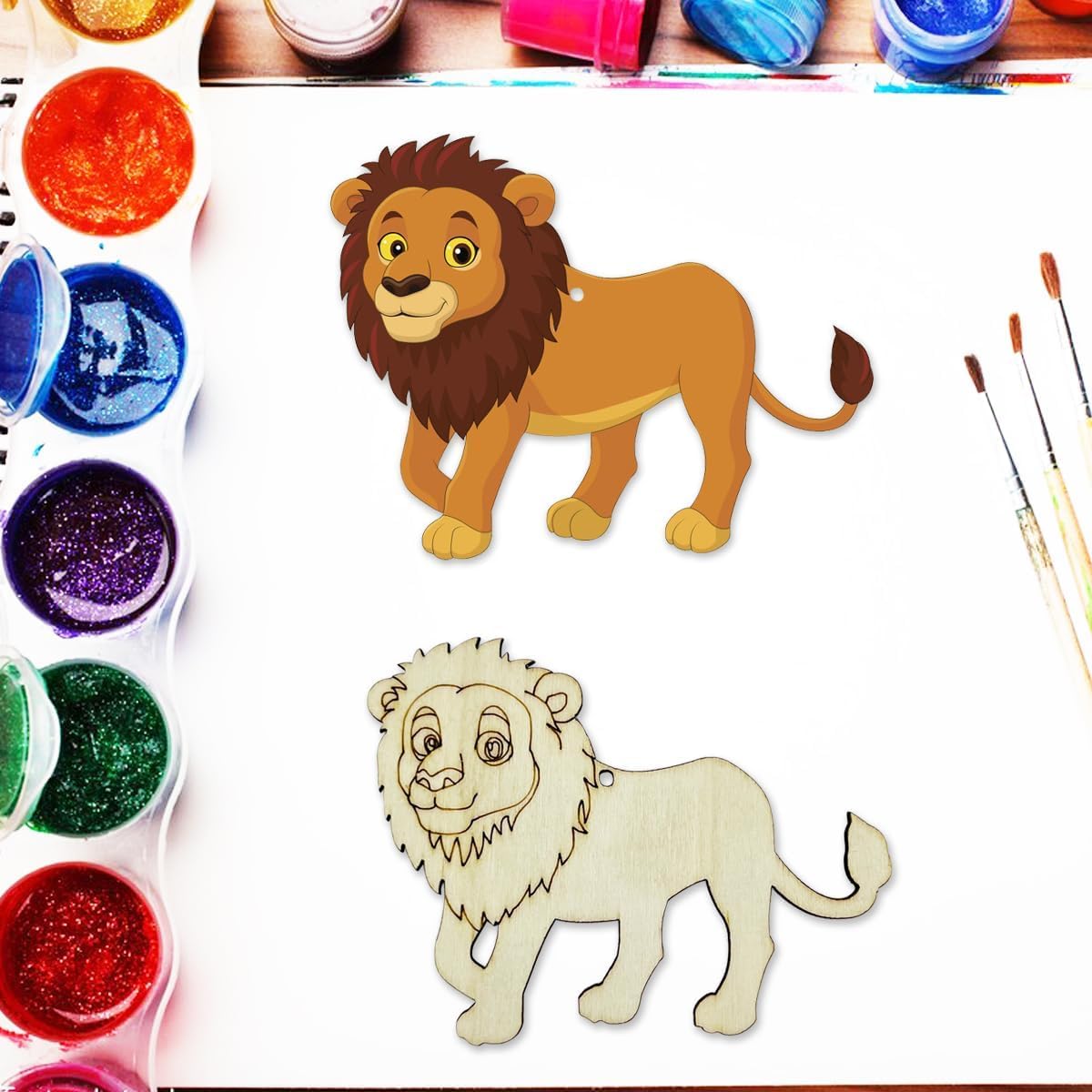 Colorful paint containers and wooden lion toys on a white background