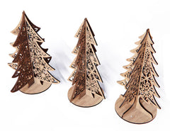Three wooden Christmas tree decorations with intricate cut-out designs on a white background
