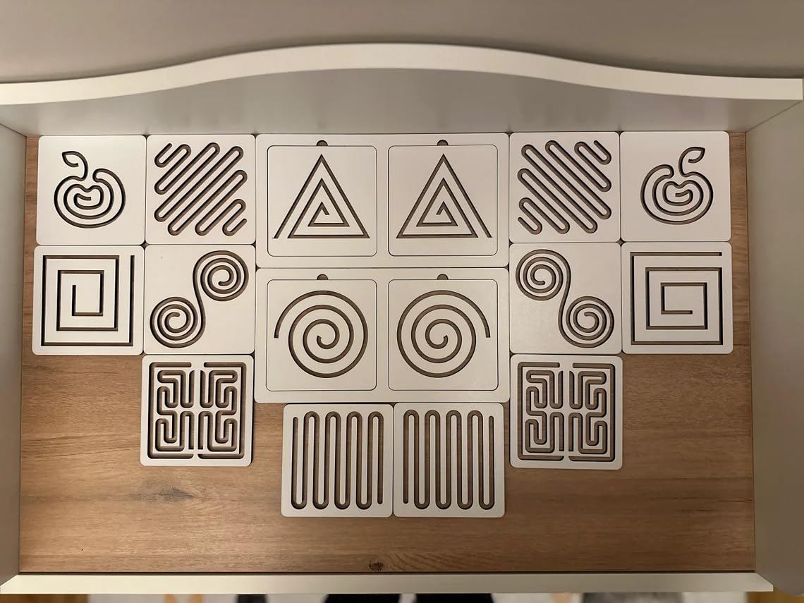 Wooden panel with geometric and natural patterned tiles on a neutral background