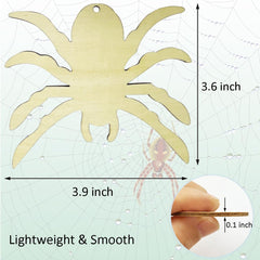 Wooden spider decoration with measurements and a hand for scale on a spider web background.