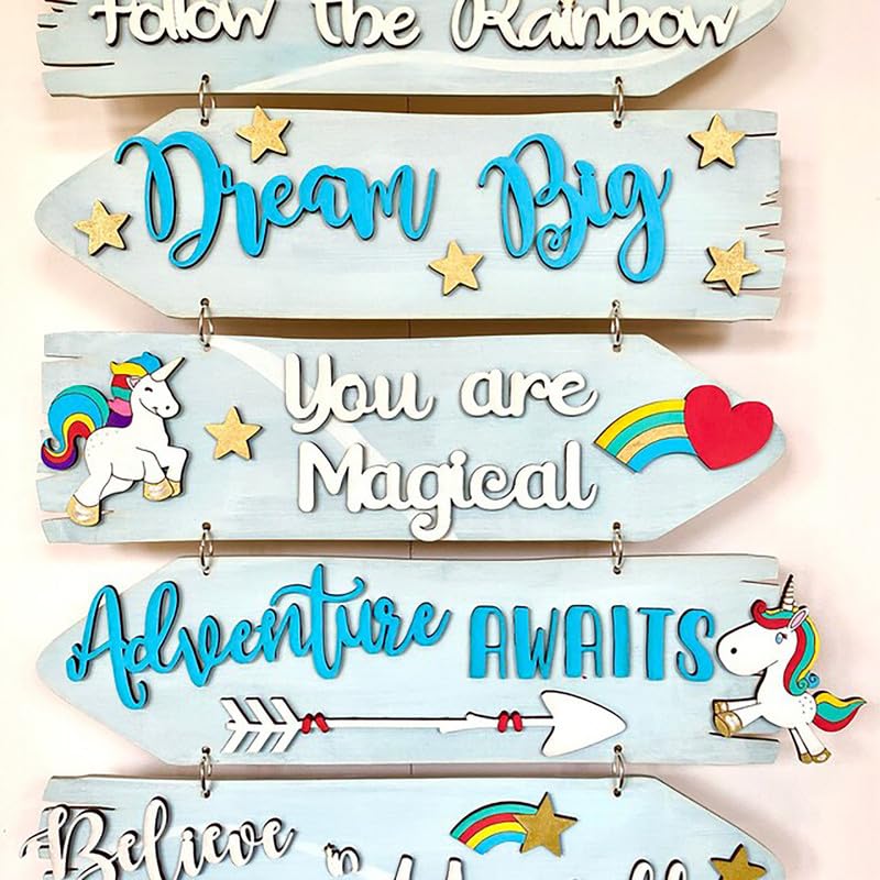 Decorative wooden signs with motivational phrases and unicorn illustrations on a light pink background.