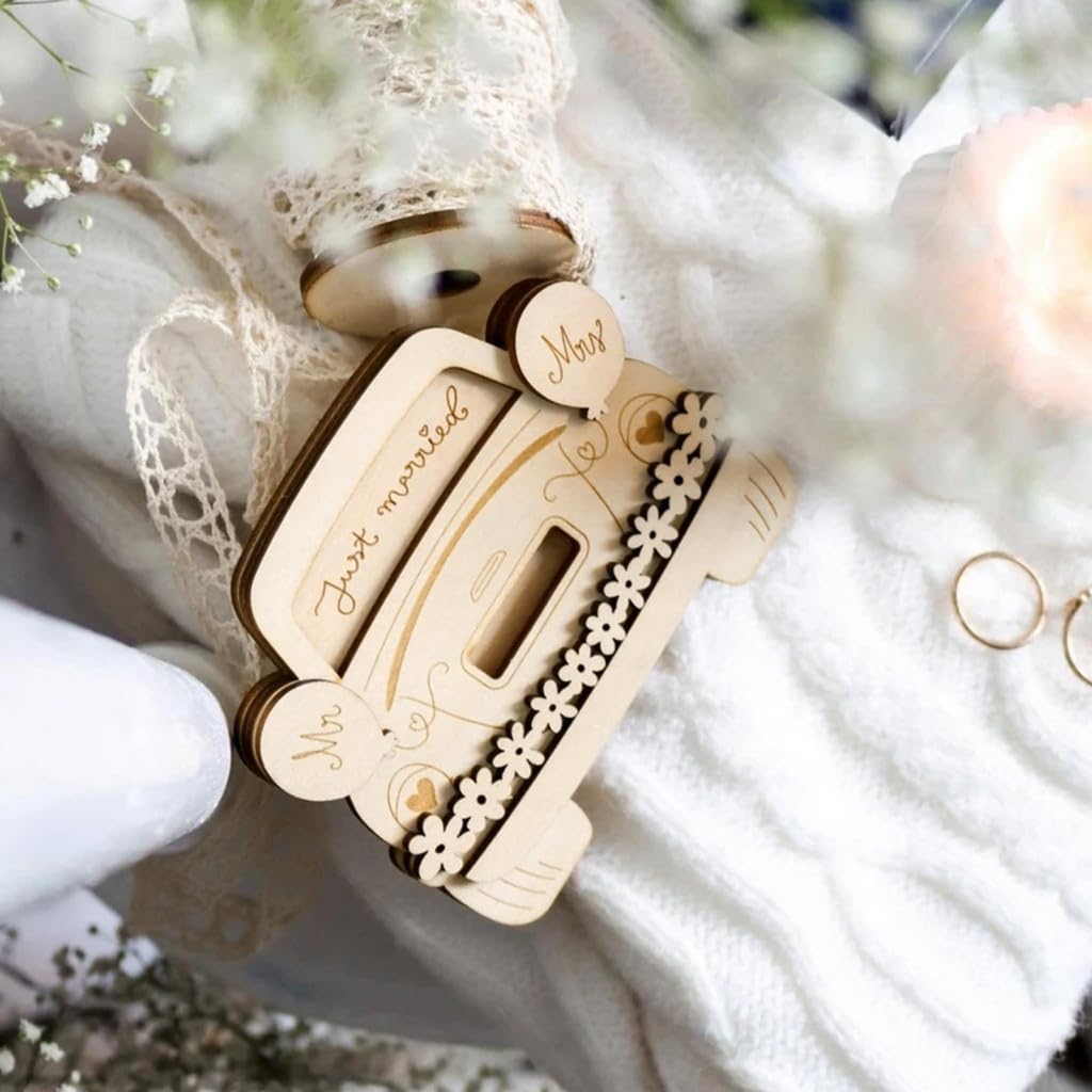 Wooden ring holder with 'Just Married' text on a white lace background