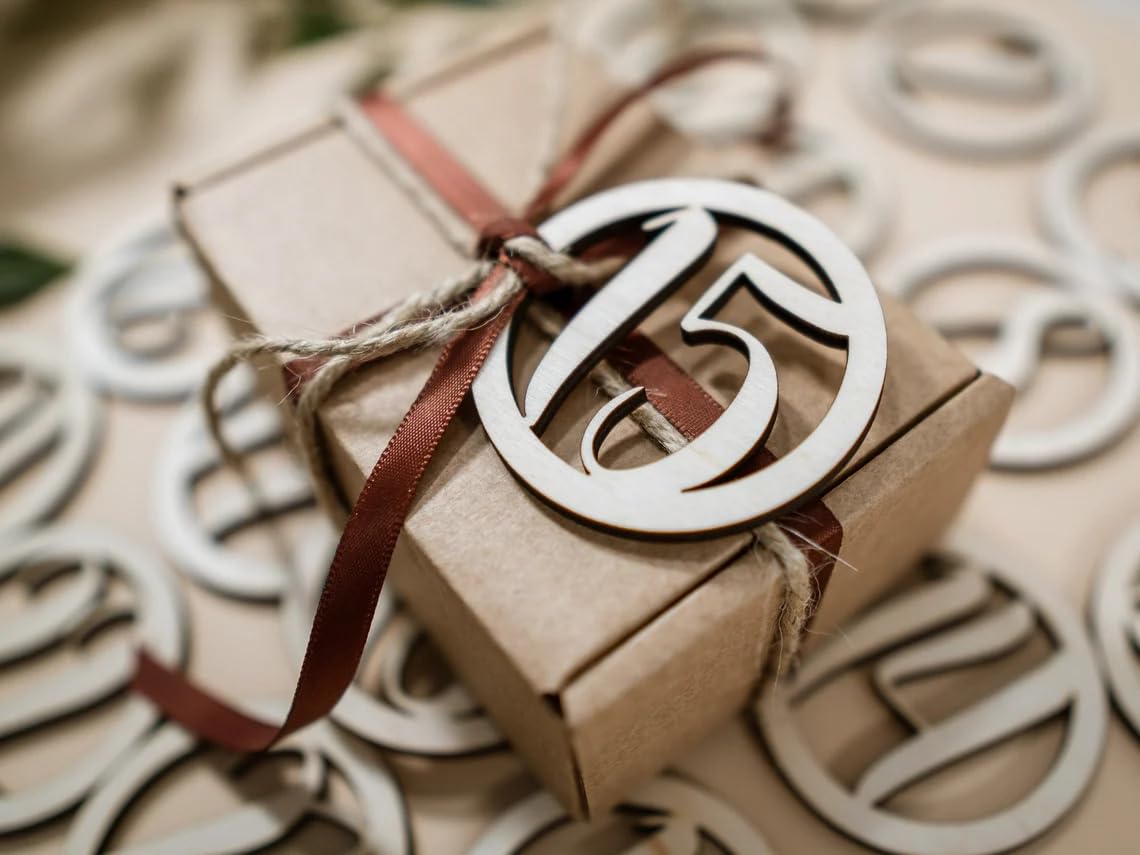 Gift box with a decorative number '15' on a patterned background