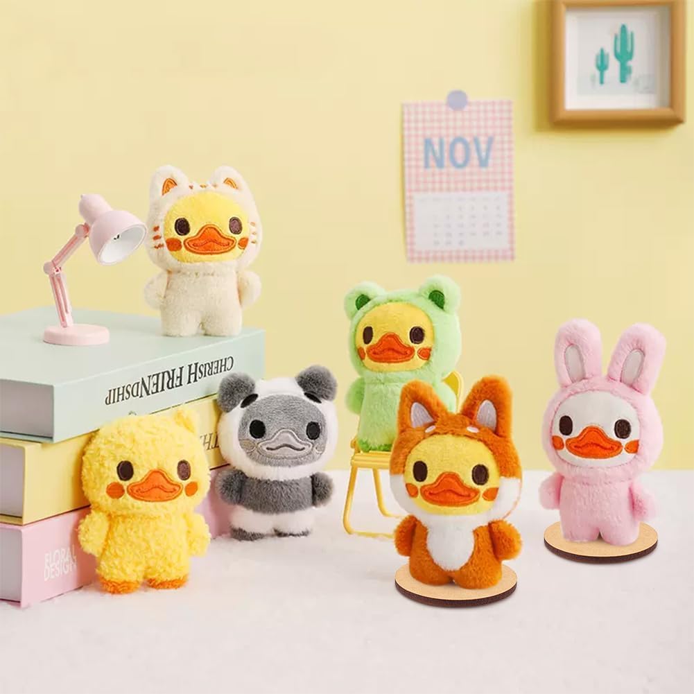 Set of colorful plush toys on a white surface with a yellow wall background