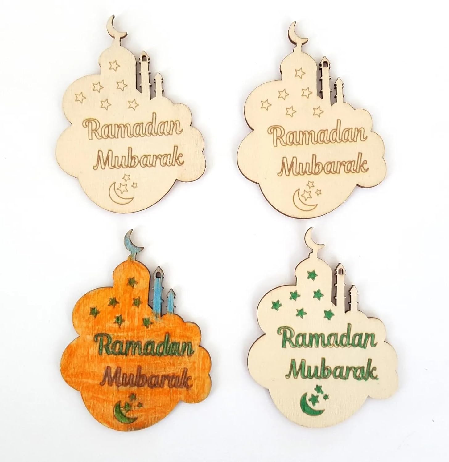 Decorative wooden ornaments with 'Ramadan Mubarak' text on a white background