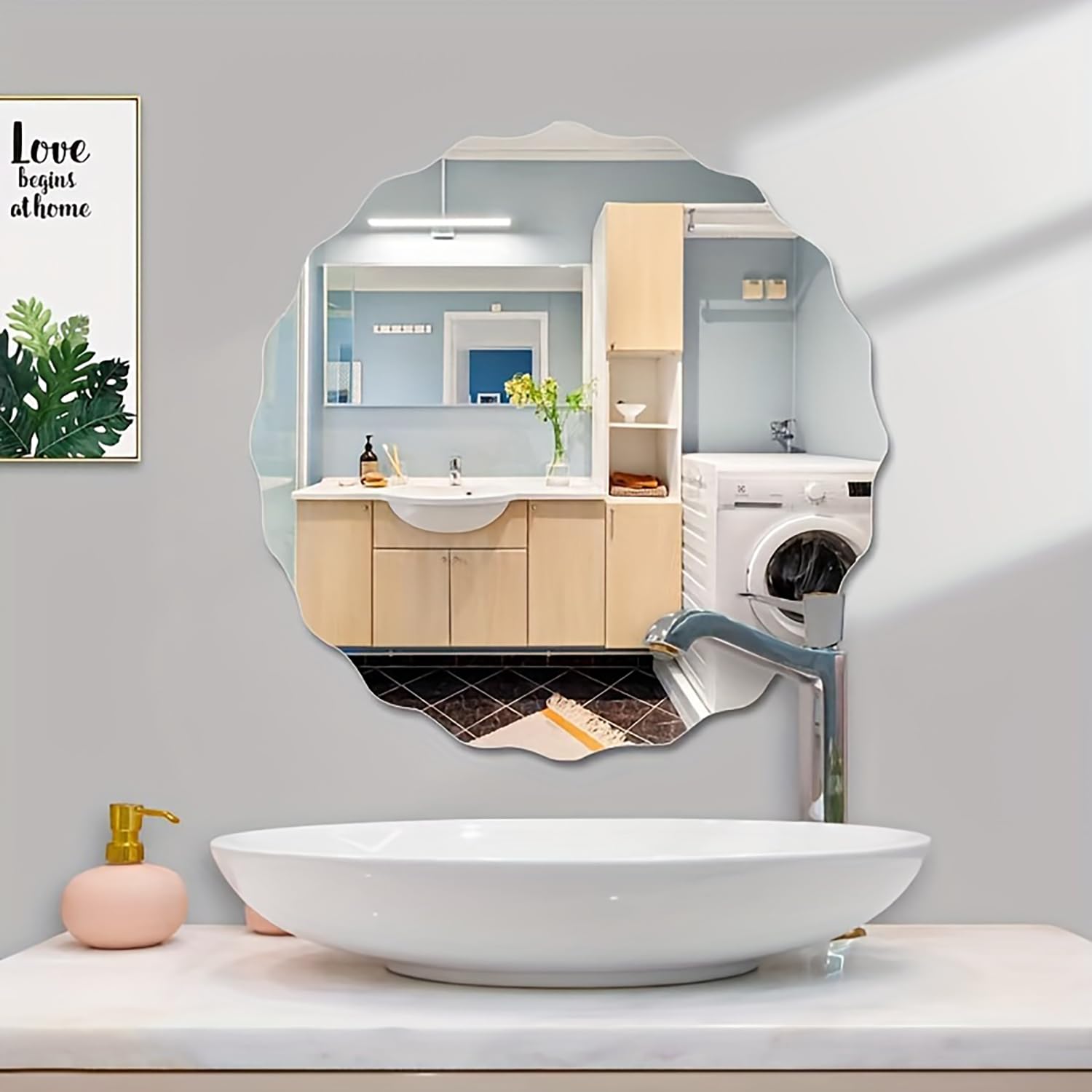 Bathroom interior with a decorative mirror reflecting a kitchen and washing machine.