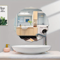 Bathroom interior with a decorative mirror reflecting a kitchen and washing machine.