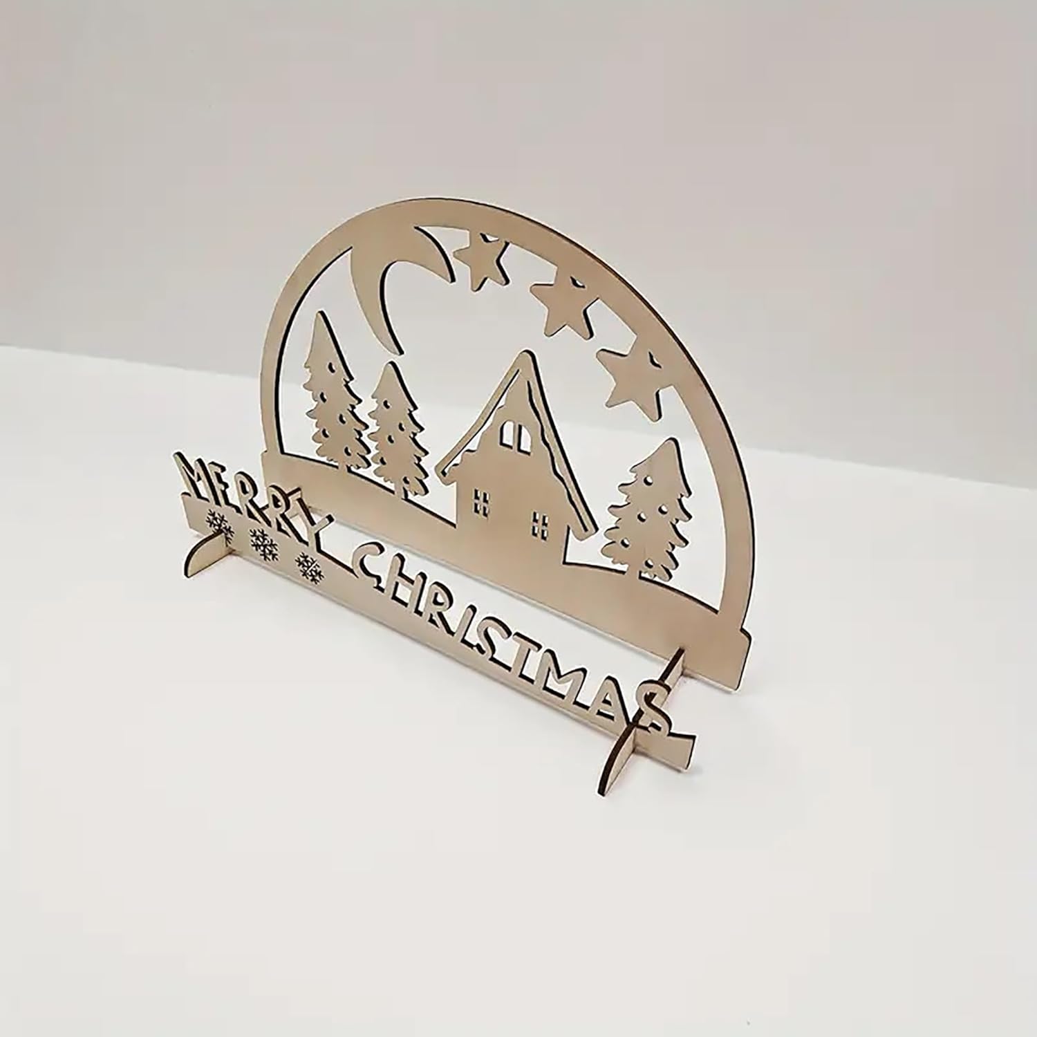 Wooden Christmas decoration with 'Merry Christmas' text and cabin design on a white background