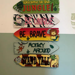 Collection of colorful wooden signs with motivational phrases and animal designs on a plain background.