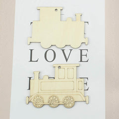 Wooden train-shaped cutout with 'LOVE' text on a light background