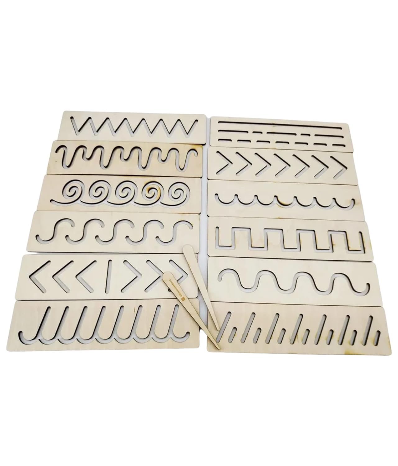 Set of wooden stencils with various patterns on a white background