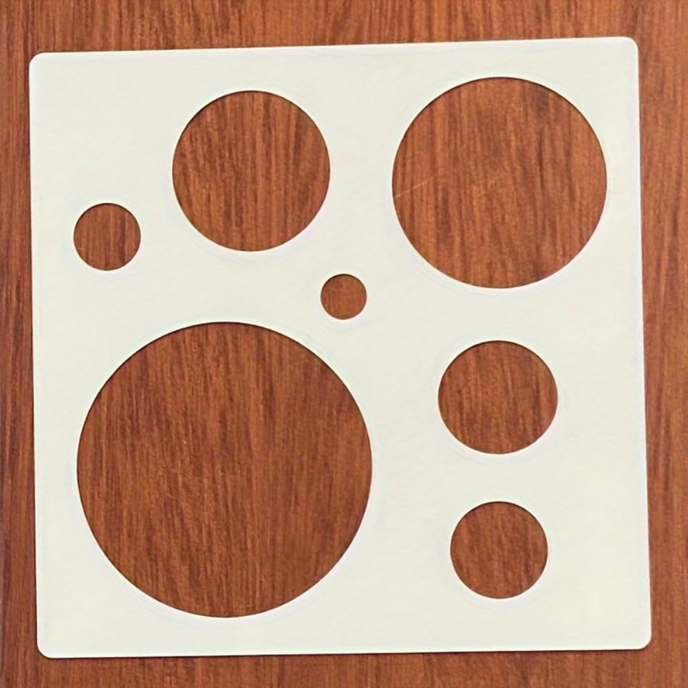 Stencil with circular shapes on a wooden surface