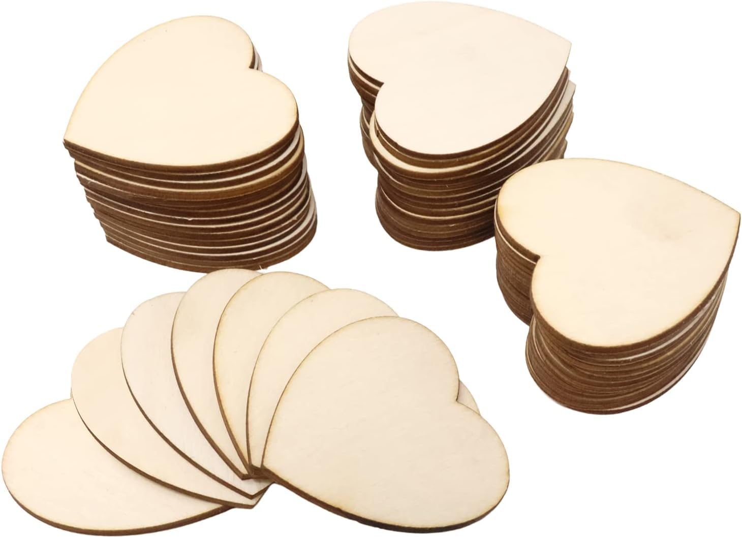 Stacks of heart-shaped wooden cutouts on a white background