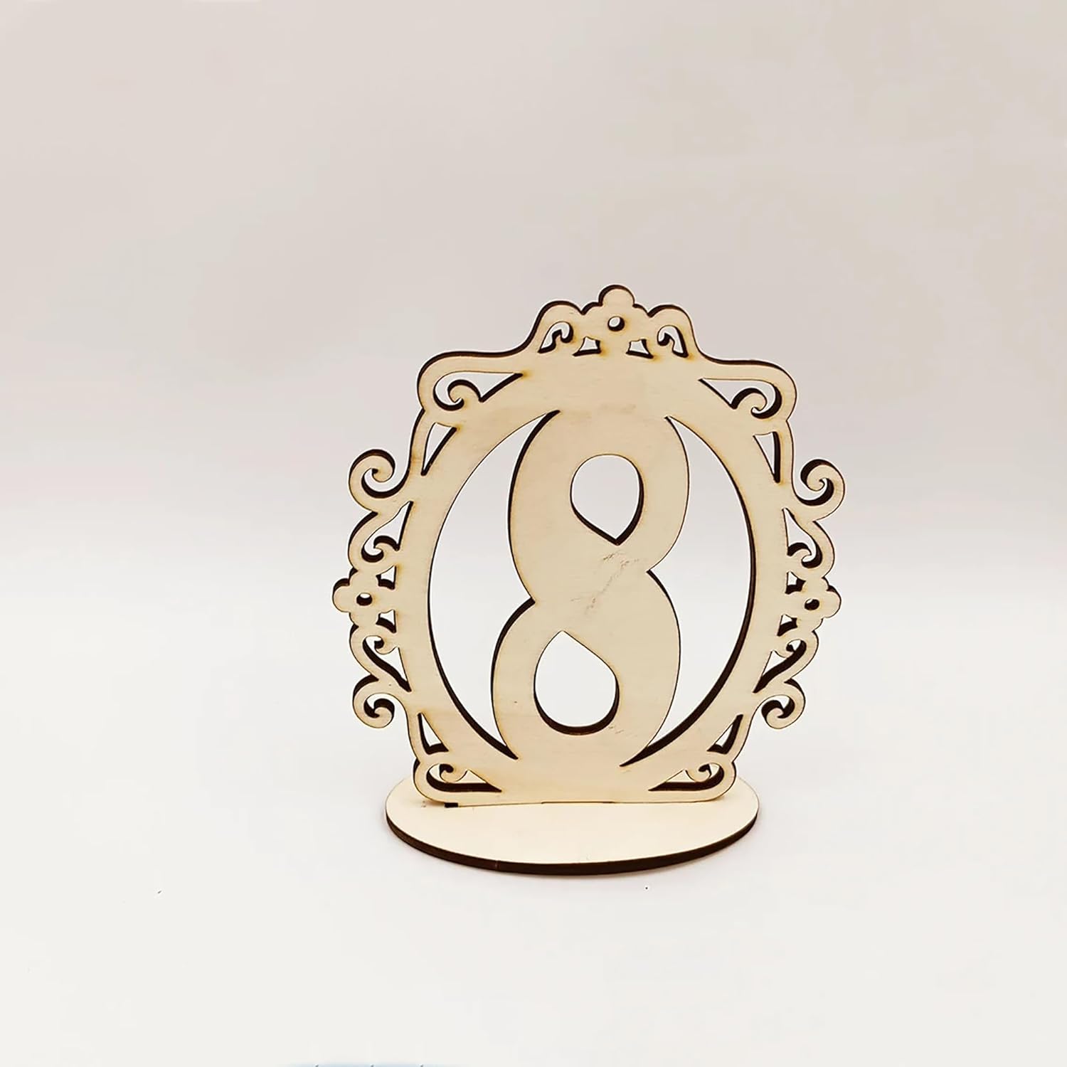 Wooden table number '8' with decorative frame on a white background