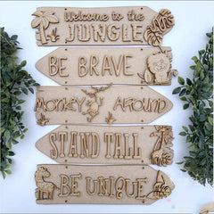 Set of wooden signs with motivational phrases and jungle-themed graphics on a white background.
