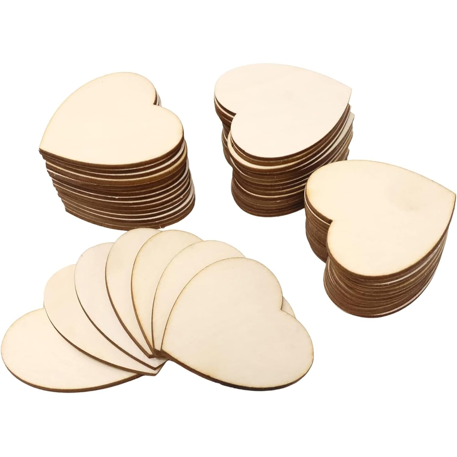 Stacks of heart-shaped wooden cutouts on a white background