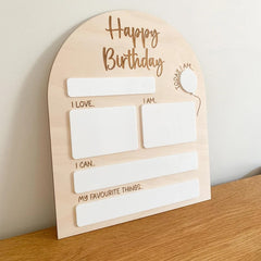 Wooden birthday card with text fields on a wooden surface
