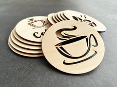 Wooden coasters with coffee cup design on a gray surface