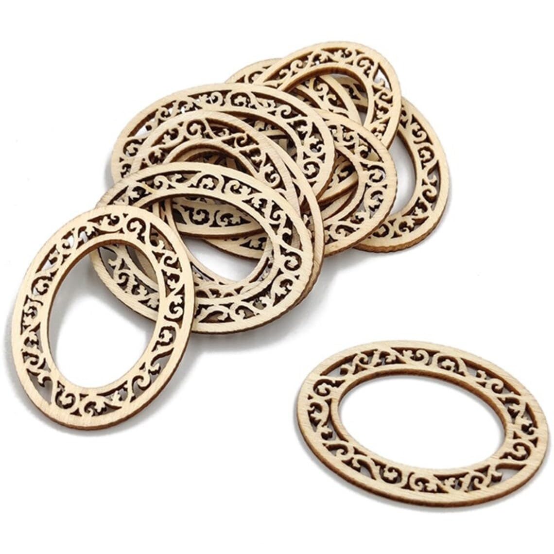 Decorative wooden rings with intricate patterns on a white background