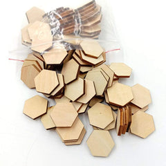Hexagonal wooden shapes with a clear plastic bag on a white background
