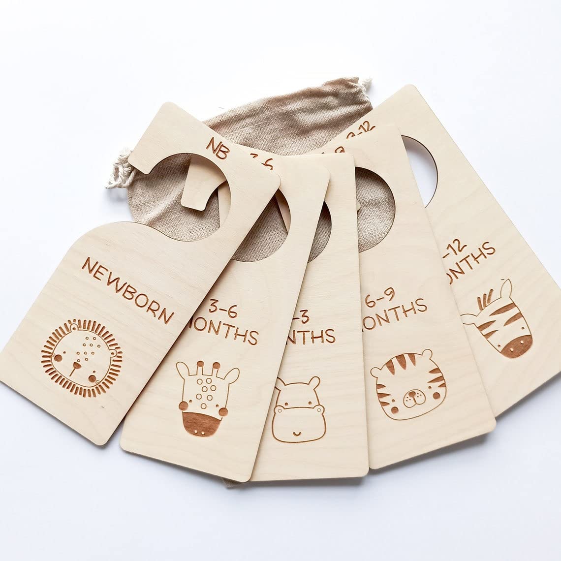 Set of baby size tags with illustrations and text on a white background