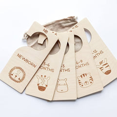 Set of baby size tags with illustrations and text on a white background