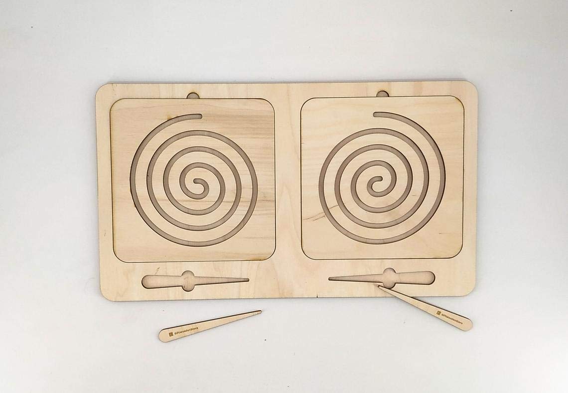 Wooden puzzle with spiral patterns and two wooden sticks on a white background