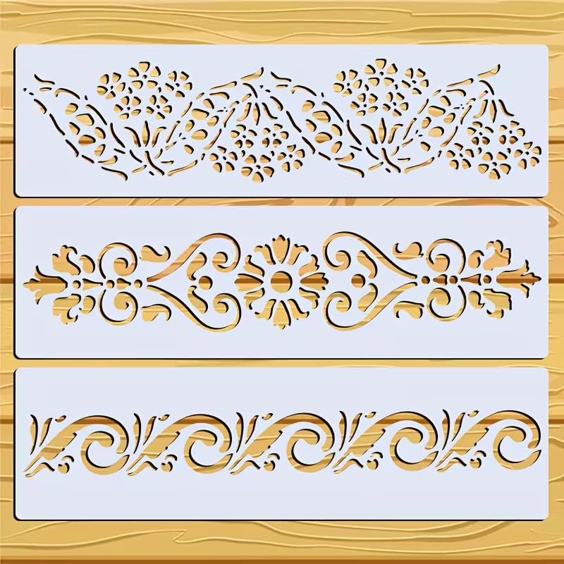 Three decorative stencils with intricate patterns on a wooden surface
