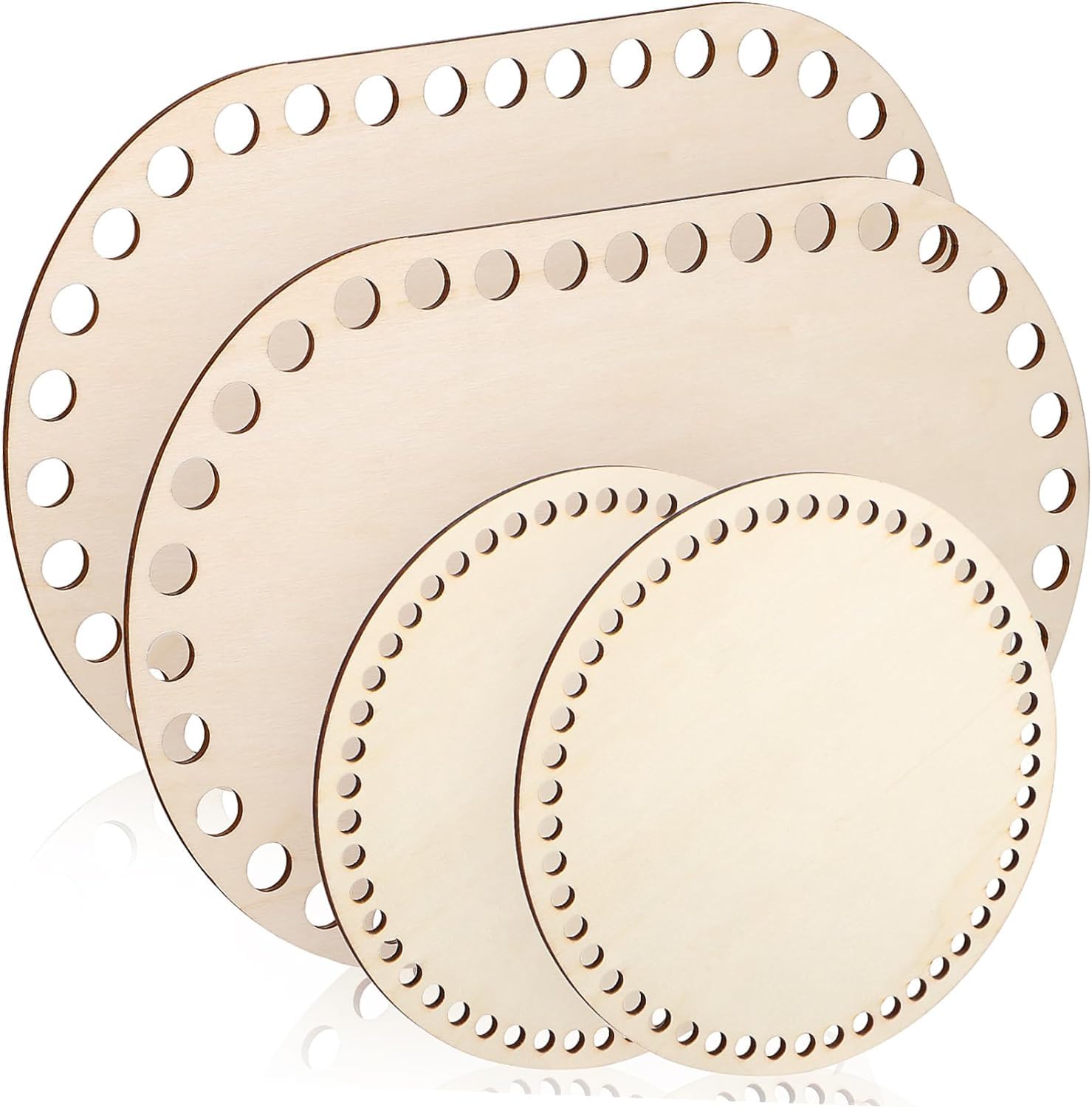 Three round wooden coasters with hole patterns on a white background