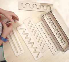 Metallic embossing tools with various patterns on a light surface