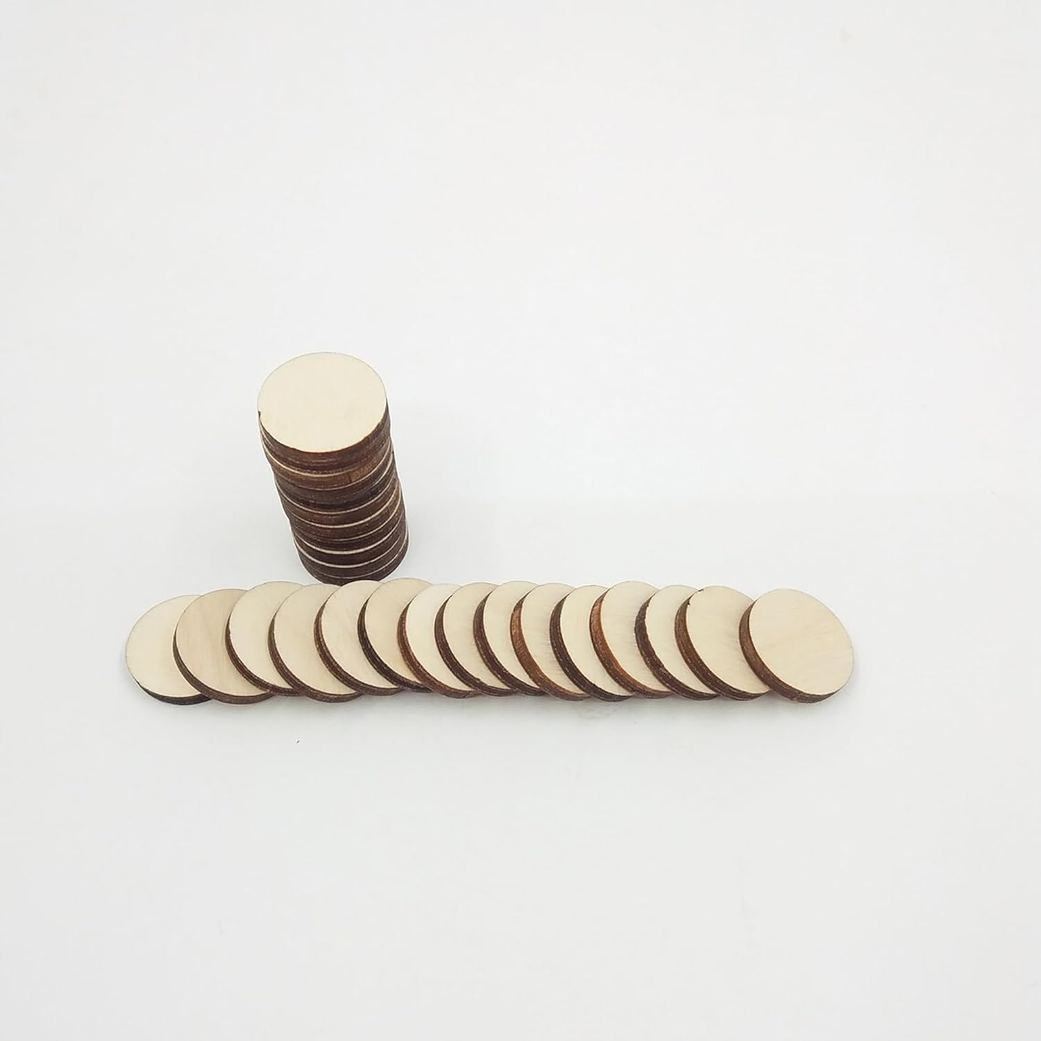 Stack of round wooden discs on a white background