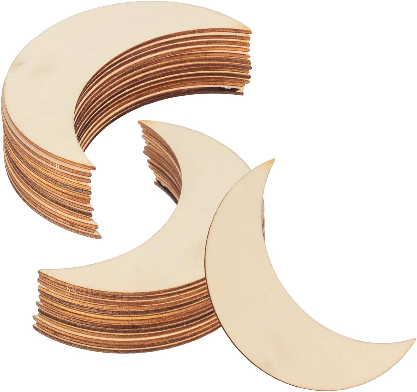Stack of crescent moon-shaped wooden cutouts on a white background