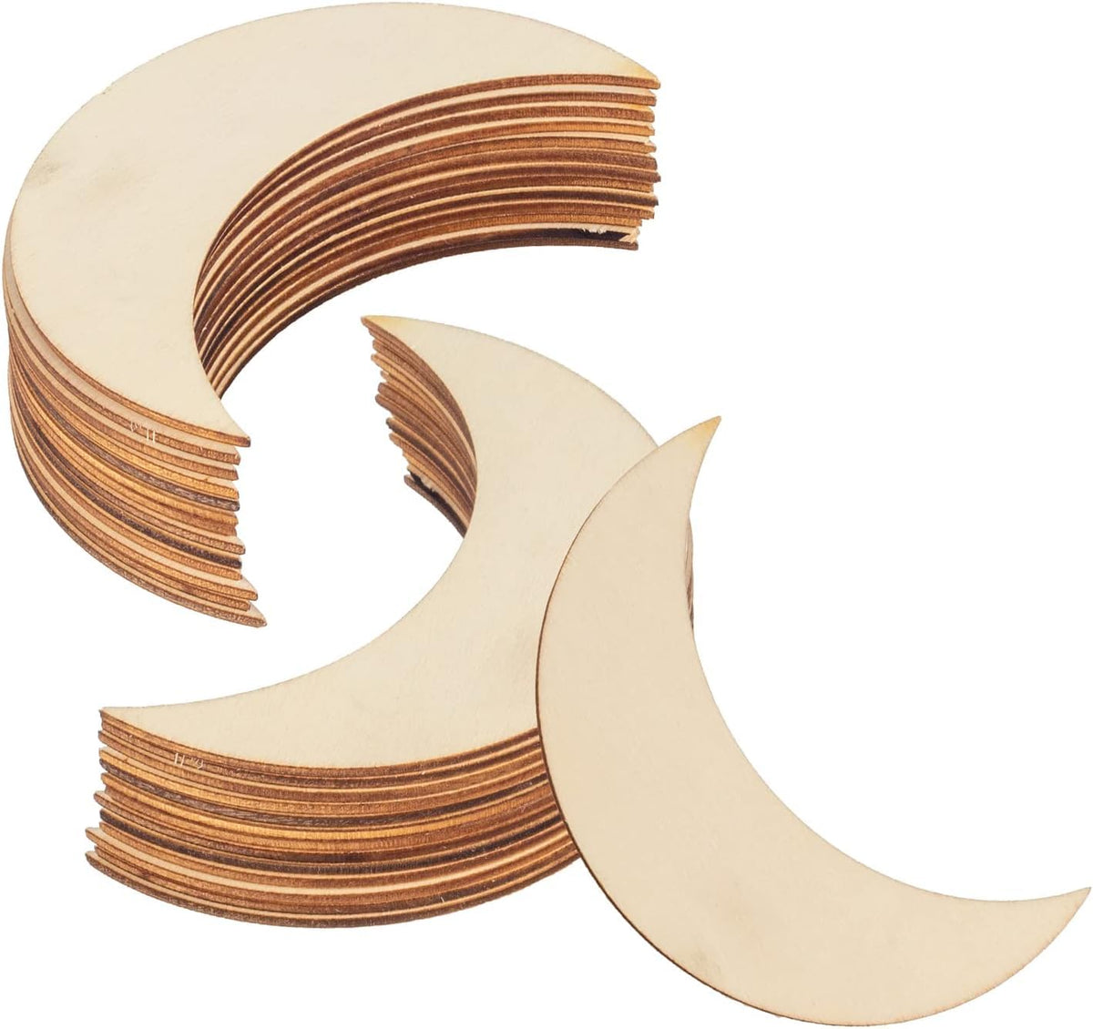 Stack of crescent moon-shaped wooden cutouts on a white background