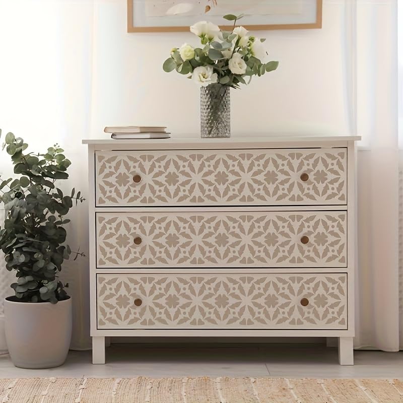 Decorative chest of drawers with a floral arrangement on top in a room setting.