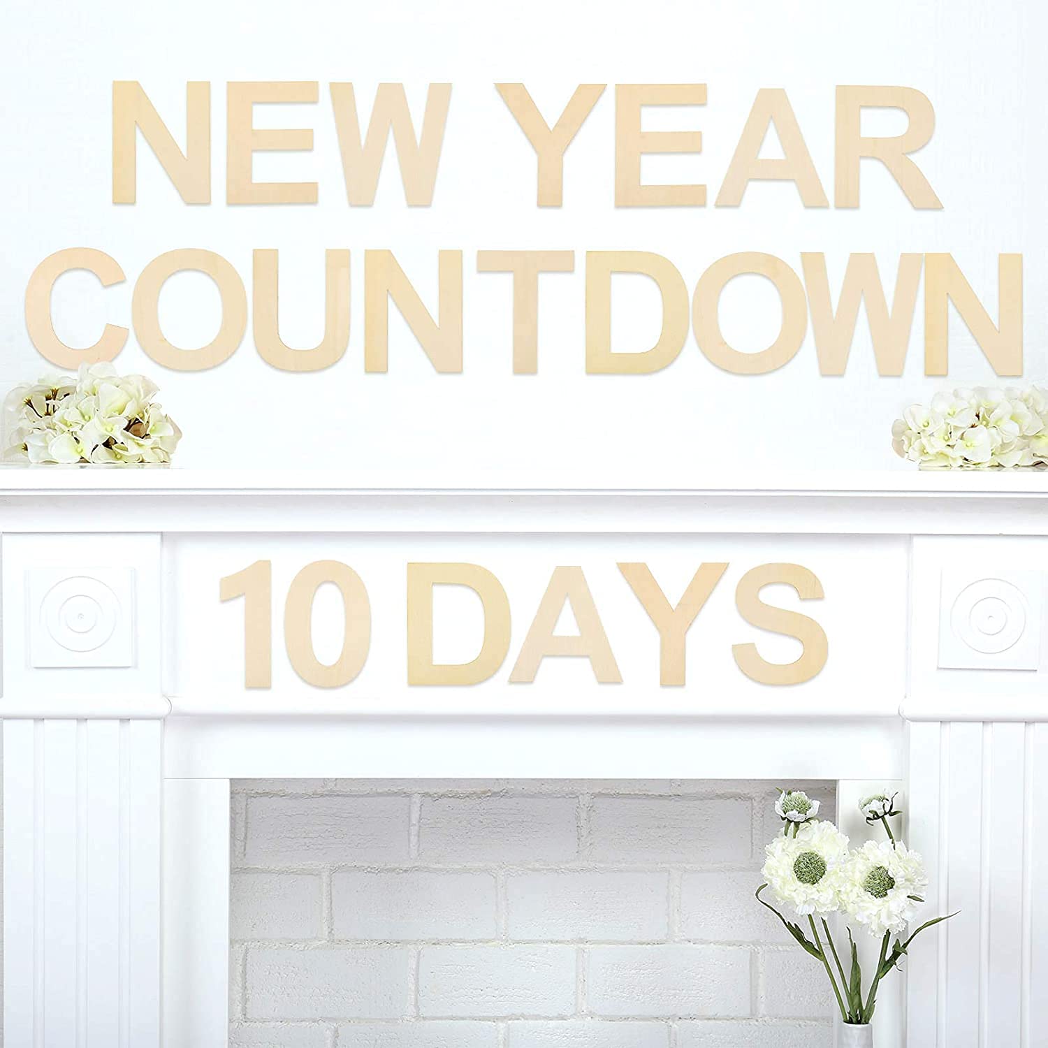 New Year countdown sign with '10 Days' on a fireplace mantel with flowers.