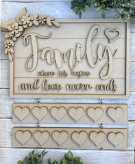 Decorative wooden sign with 'Family where life begins and love never ends' text on a wooden background.