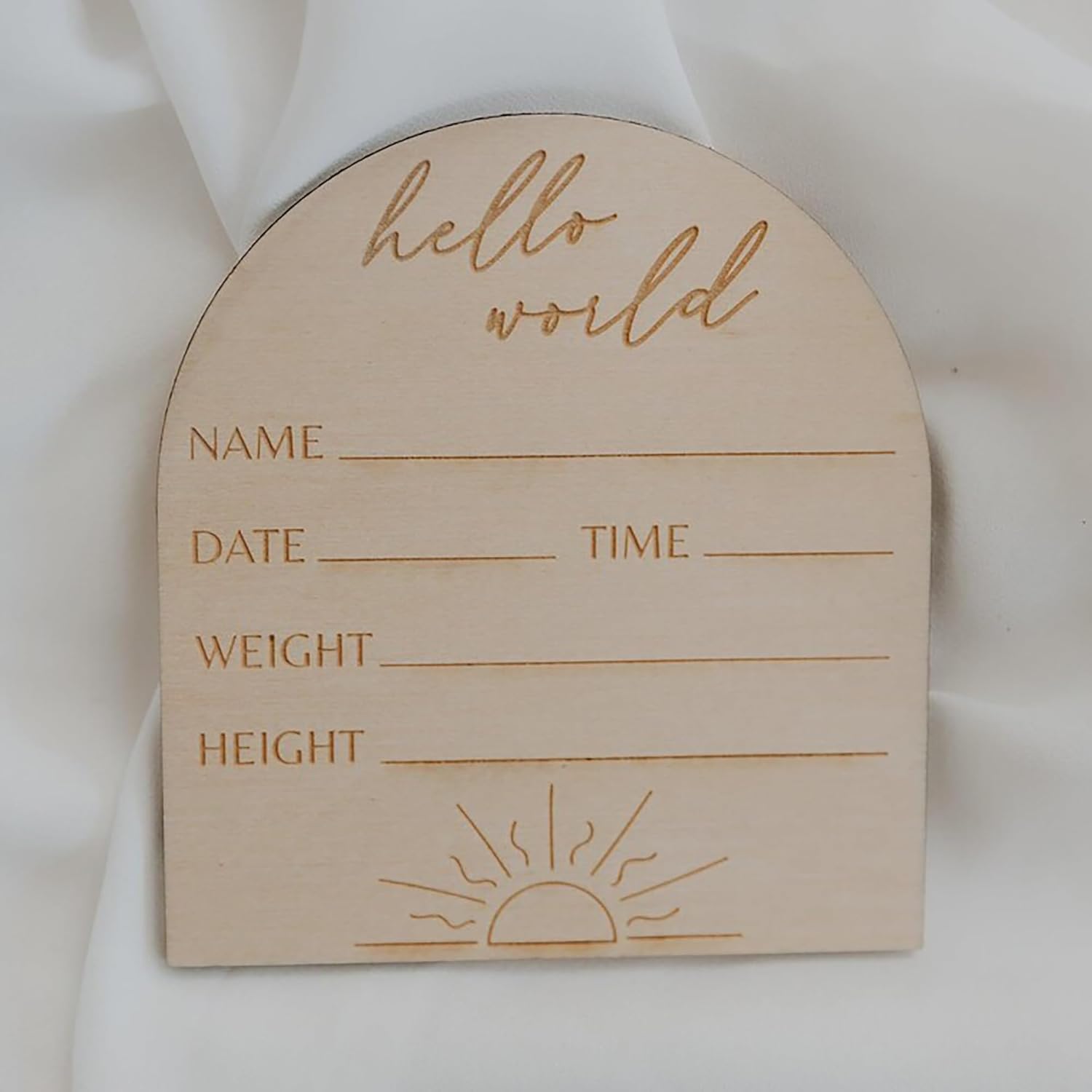 Wooden baby milestone card with 'hello world' text and blank lines for personalization on a white background.