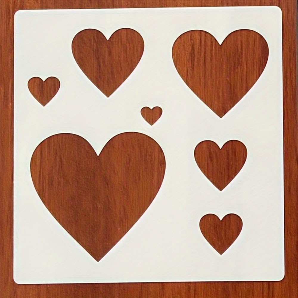 Set of wooden heart shapes on a white card with a wooden background
