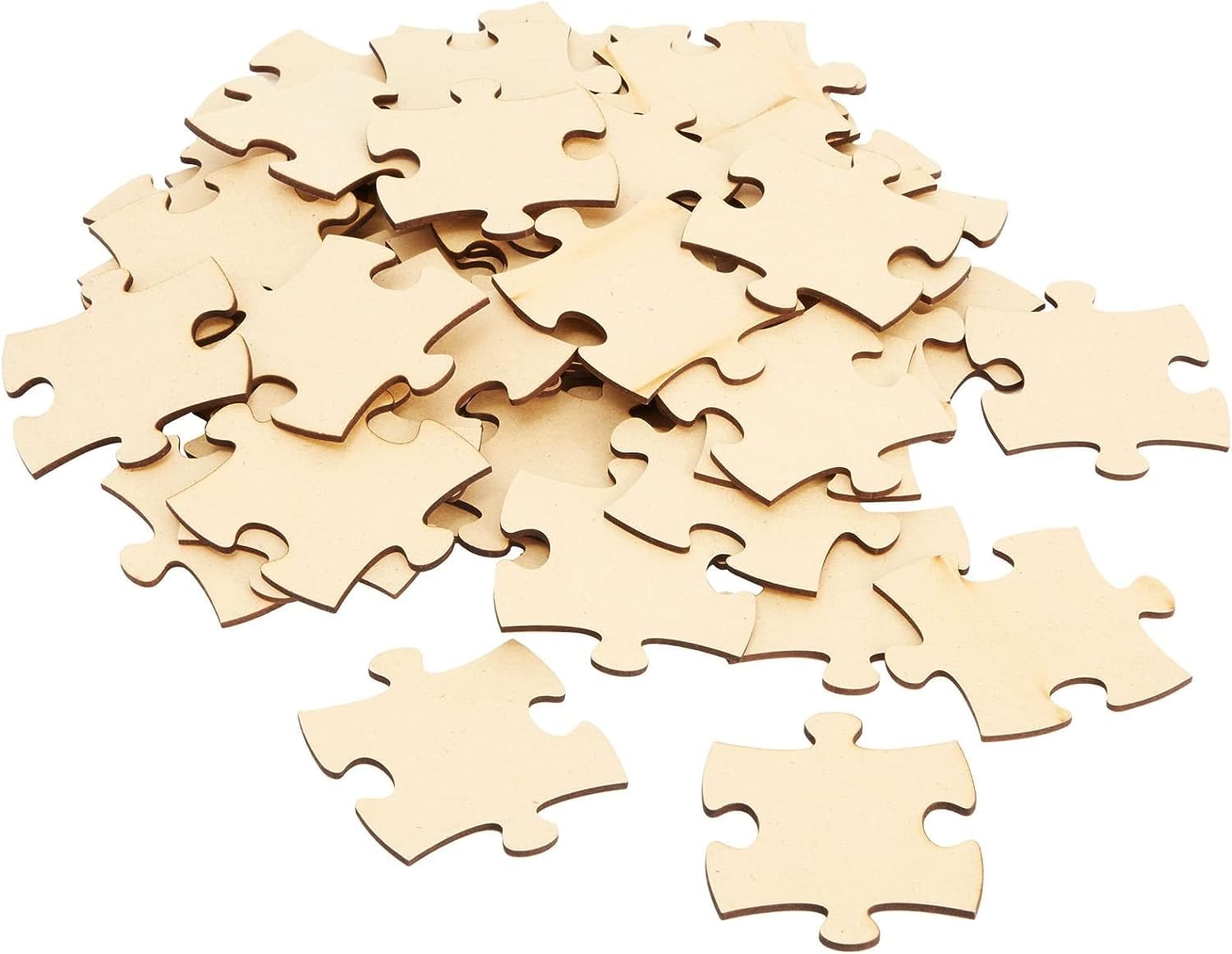 Unfinished wooden puzzle pieces on a white background