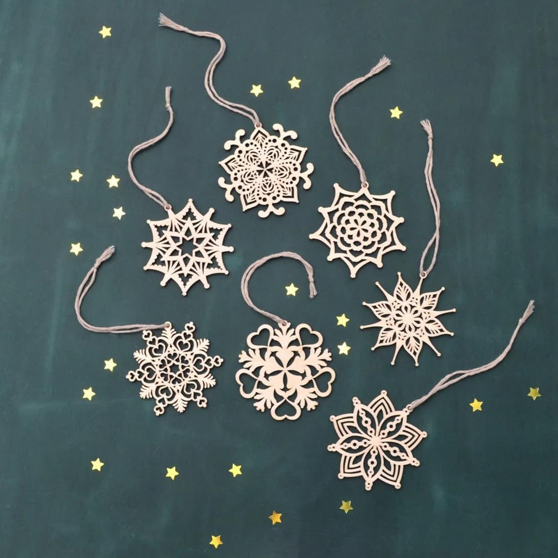 Decorative snowflake ornaments on a dark background with small stars.