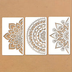 Three decorative stencils with intricate patterns on a beige background